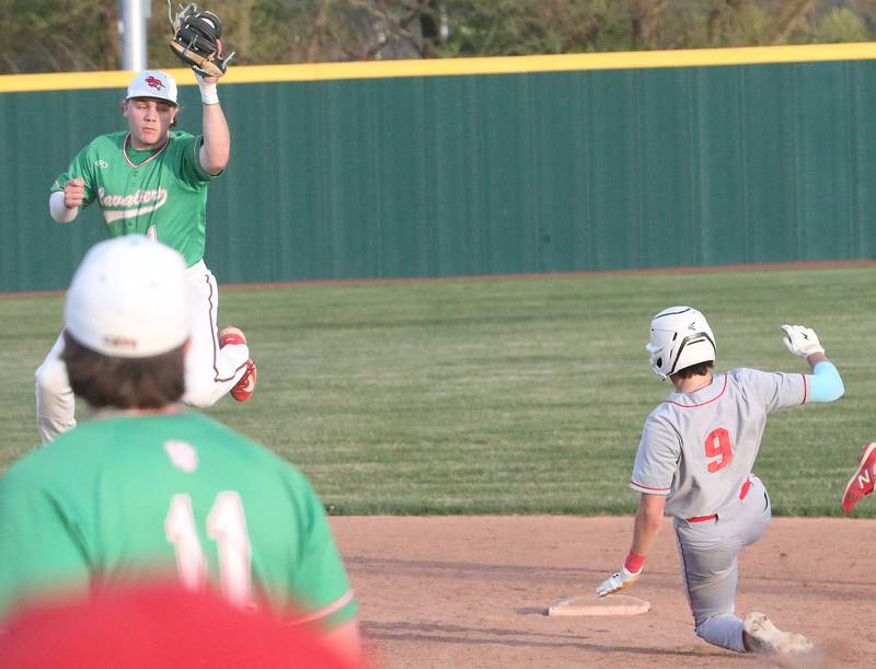 L-P's Kaedin Bond catches the ball at second base as Ottawa's Jack Henson slides in safely to the bag at Huby Sarver Field inside the L-P Athletic Complex on Tuesday, April 23, 2024 in La Salle.