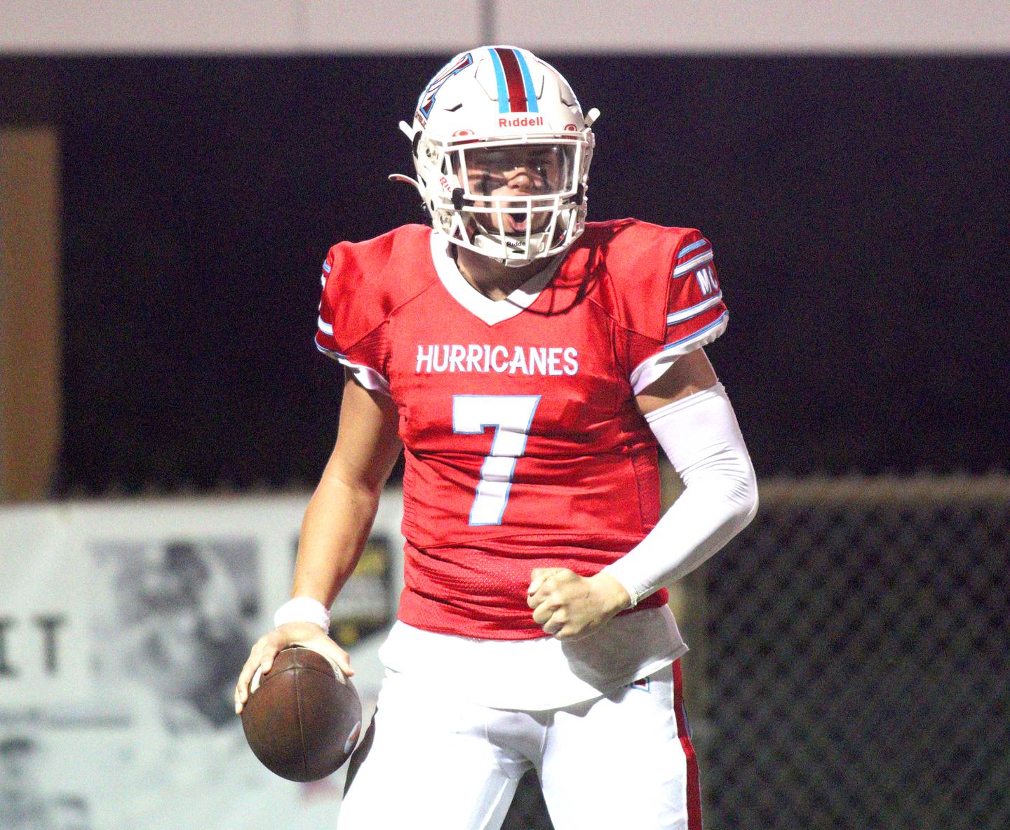 Marian Central’s Cale McThenia celebrates a touchdown against Chicago Hope in varsity  football  at Woodstock Friday night