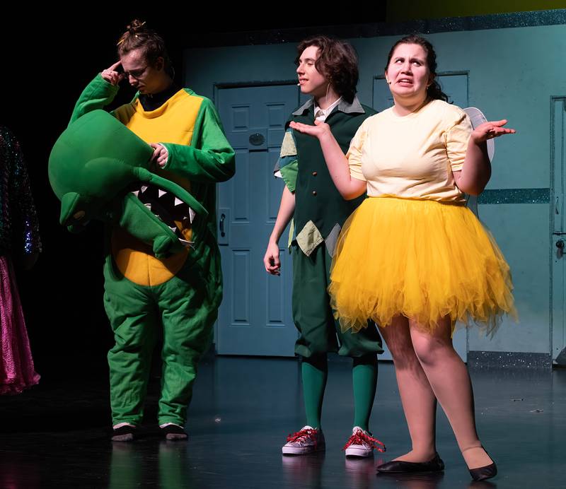 Ottawa High School seniors Scarlet Pohar as Saige, Gabe Nye as Finn, and Corinne Francis as Charlie, rehearse a scene from the first act of "Standing Tiptoe."