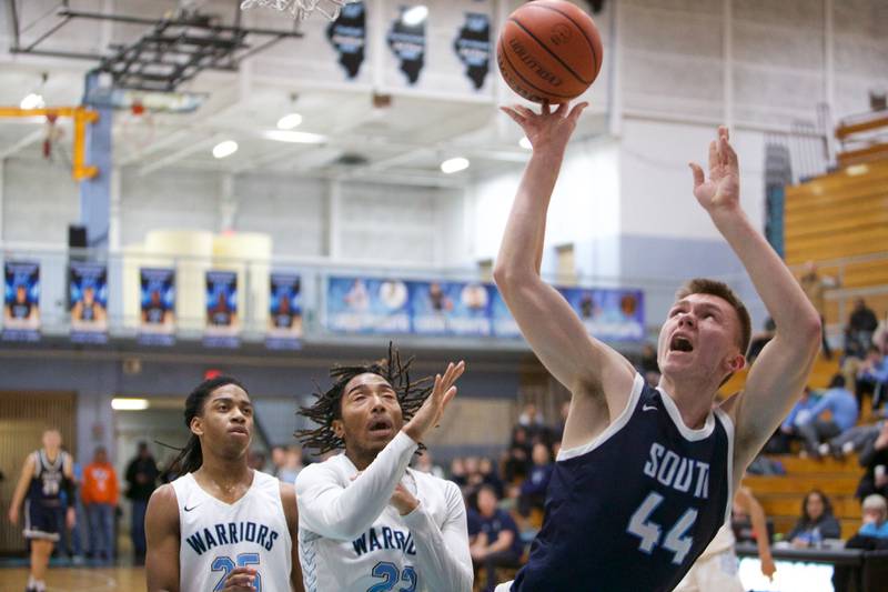 Downer's Grove South's Justin Sveiteris puts up the shot against Willowbrook drawing the foul on Friday, Feb.2,2024 in Villa Park.