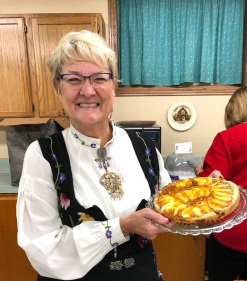 Barb Johnson, culture director for Polar Star Lodge, displays eplekake (apple cake) one of the Norwegian Speciality cakes featured at the "Taste of Norway" Høstfest planned for Nov. 6.