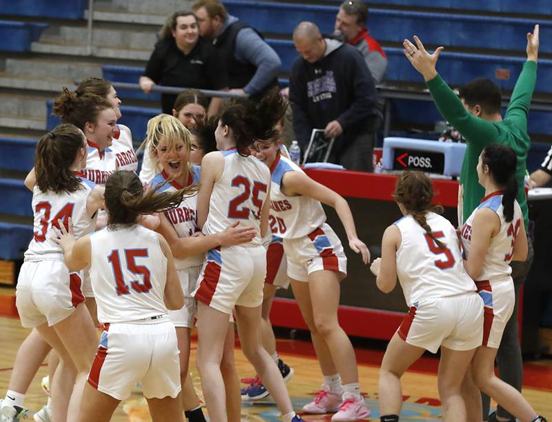 Marian Central  celebrates their come from behind victory over Rockford Lutheran in a non-conference girls basketball game Monday, Dec. 12, 2022, at Marian Central Catholic High School, in Woodstock.