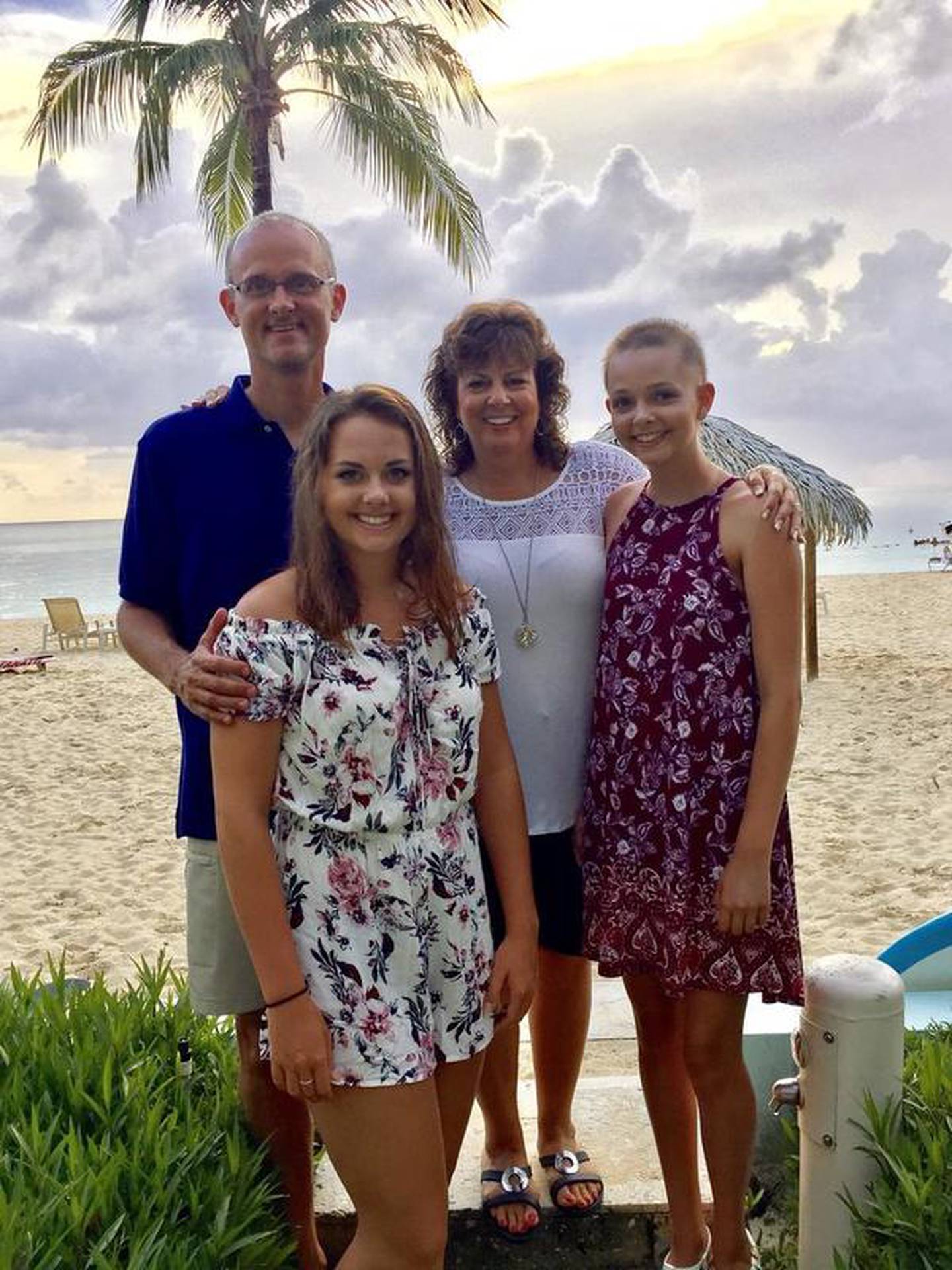 Megan Bugg of Coal City was chosen as the Grundy County Corn Festival 2017 parade grand marshal. Bugg said she wants to use this opportunity to create awareness of childhood cancer, as she has battled cancer for three years.Pictured are Megan Bugg (right) with her mother Deb, father Kent and sister Kenzi.