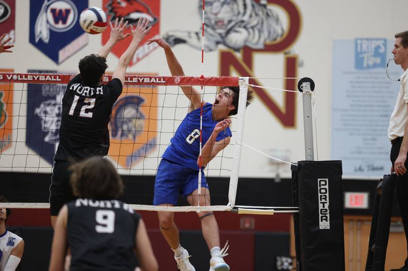 Lincoln-Way East’s Trey Marek hits a shot down the line against Plainfield North on Tuesday, April 2, 2024.