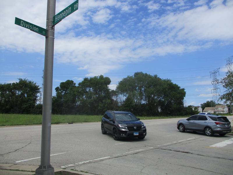 Traffic. moves through the intersection of Division Street and Hennepin Drive in Joliet, an area where a developer wants to build one or more warehouses. June 24, 2024