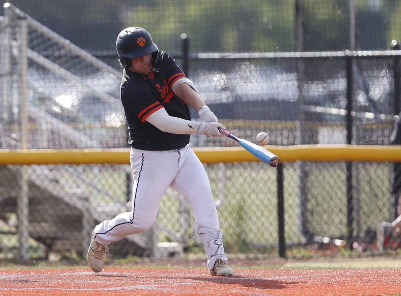 Wheaton Warrenville South's Jayce Maranell (5) makes contact with the ball during the Class 4A York regional semi-final between Wheaton Warrenville South and St. Charles East in Elmhurst on Thursday, May 23, 2024.