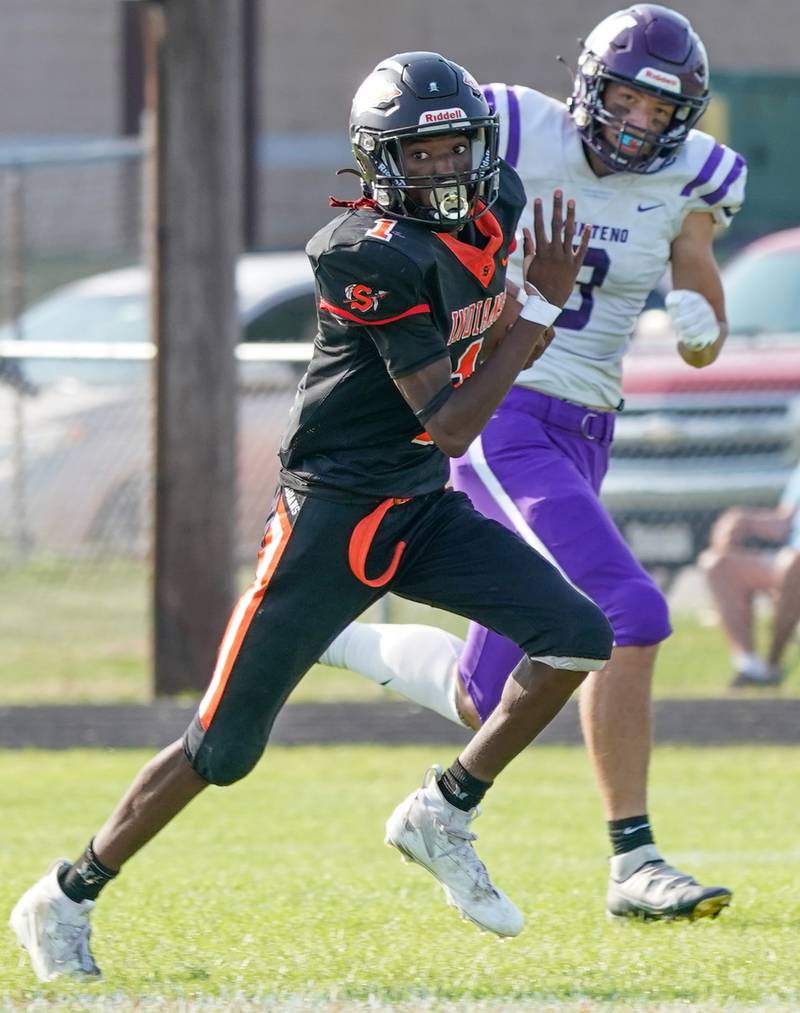 Sandwich Simeion Harris (1) carries the ball against Manteno during a football game at Sandwich High School on Saturday, Aug 26, 2023.