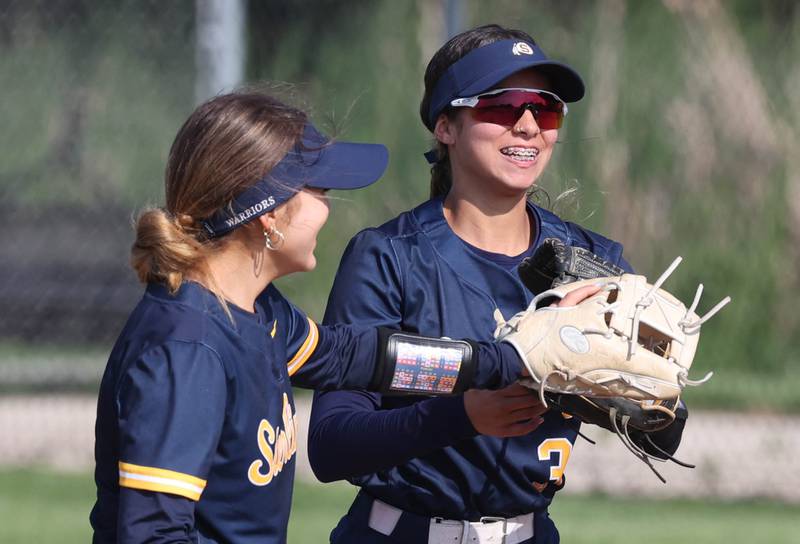 Sterling's Lilly Cantu (right) is congratulated by a teammate after makes a running catch during their game against Sycamore Tuesday, May 14, 2024, at Sycamore High School.