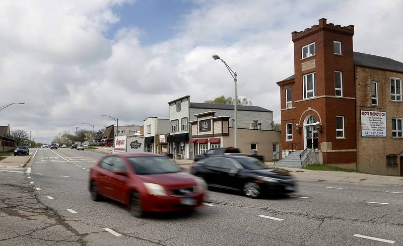 Traffic streams through the intersection of Route 14 and West Main Street in Cary on Tuesday, April 25, 2023. The village of Cary is considering a new tax increment financing district in its downtown corridor to help spur new development in the oldest part of its town.