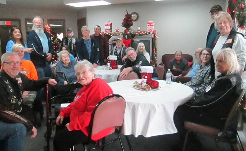 Members from American Legion Riders Post #181 from Sandwich and Open Roads ABATE present gift cards to residents at Deer Run Apartments in Plano. Pictured are Mike Rennels, Plano Rockin’ Christmas president; Bob Lawrence, Cliff Oleson, Sandy Lawrence, Adam Arnett, Bill Kolb, Kevin Smith, Sally Kolb, Bob Mauer, Patti Smith and Cherie Mauer.