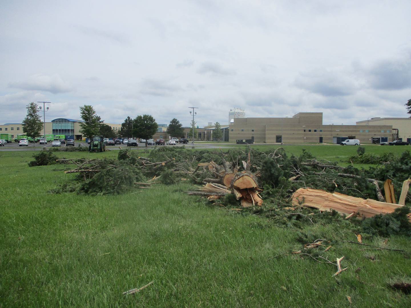 Fallen trees and limbs on the Plainfield South High School campus were being cut up Tuesday after the storm that damaged scattered sections of Joliet the previous night. July 16, 2024