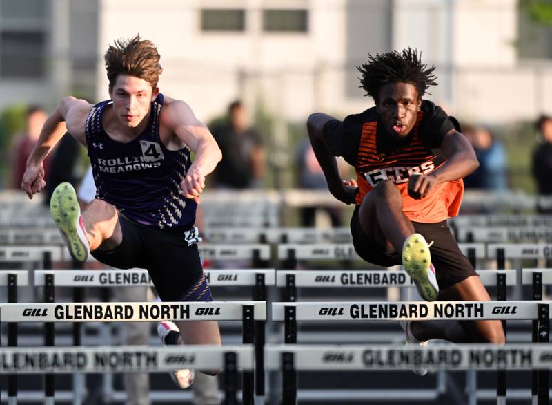 Rolling Meadows’ Noah Heiber, left, and Wheaton-Warrenville South’s Amari Williams compete in the 110-meter high hurdles during the Class 3A Glenbard North boys track and field sectional on Thursday, May 16, 2024 in Carol Stream.