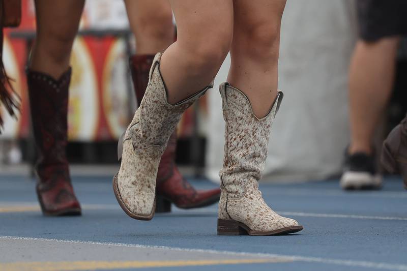 Festival goers brough out the cowboy boots for the Taste of Joliet’s country night on Saturday, June 22, 2024 at Joliet Memorial Stadium.