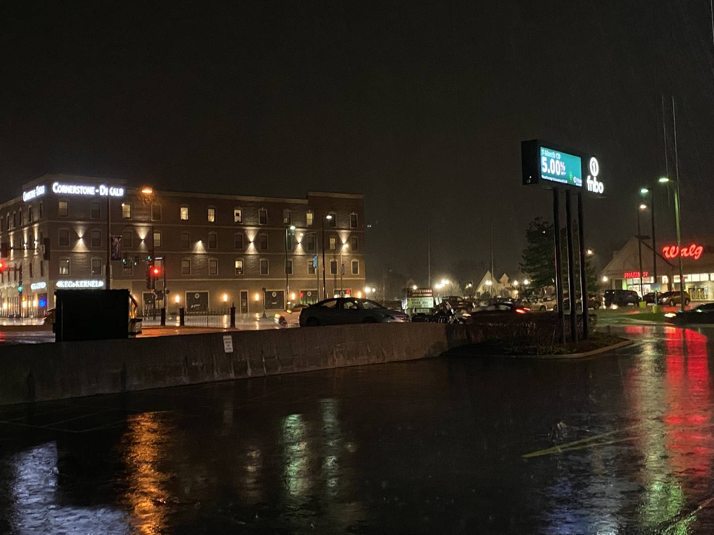 Sleet, heavy rain and hail pummels downtown DeKalb along West Lincoln Highway on Tuesday night, Feb. 27, 2024, during a severe thunderstorm and tornado warning weather event, which the National Weather Service called "rare" for this time of year.