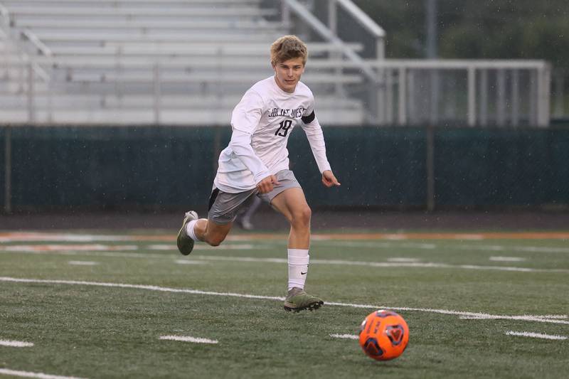 Joliet West’s Ethan Podmolik runs down the ball against Romeoville on Wednesday, Oct. 11, 2023 in Romeoville.