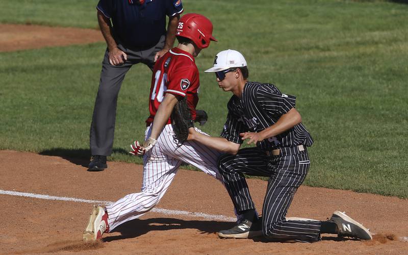 Prairie Ridge's Karson Stiefer tries to tag Deerfield's Charlie Gault as he goes back toe first base during a Class 3A Deerfield baseball regional game on Wednesday, May 22, 2024, at the Deerfield High School.