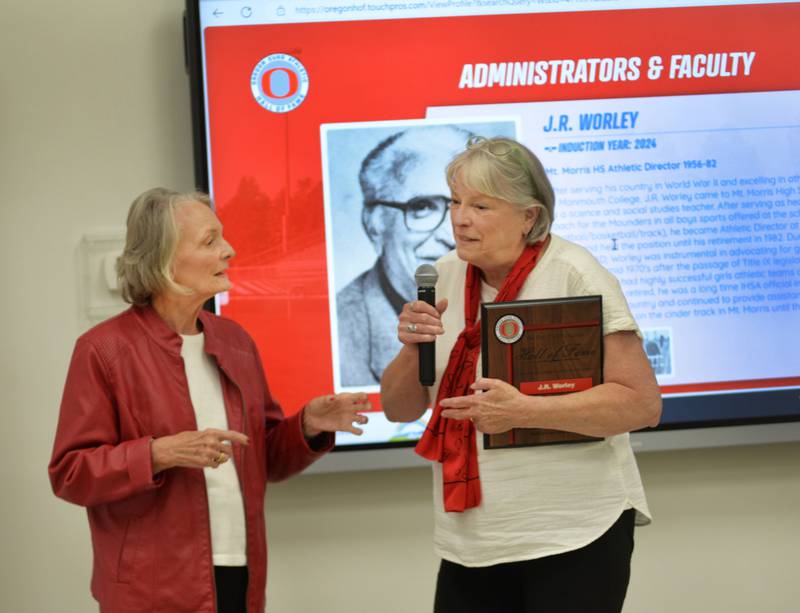 JR Worley's daughters Jo Sanders (left) and Chris Stabile accepted the OCUSD Hall of Fame award for their late father during the school district's inaugural induction ceremony on Saturday, Sept. 14, 2024 at the Rock River Center in Oregon.