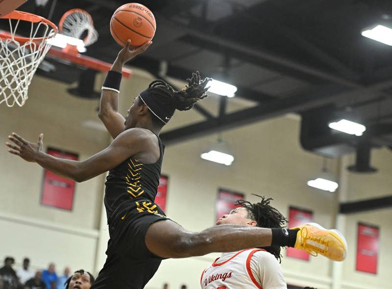 Joliet West's Justus Mcnair soars to the basket for a shot during the Class 4A sectional semifinal against Homewood Flossmoor at Rich Township on Tuesday, Feb. 27, 2024, at Richton Park. (Dean Reid for Shaw Local News Network)