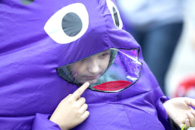 Dressed as Grimace, Graham Bouland, 9, checks out Dixon Washington School’s trunk or treat Wednesday, Oct. 25, 2023. The fun event was open to preschool and kindergarten students and their families at the school.