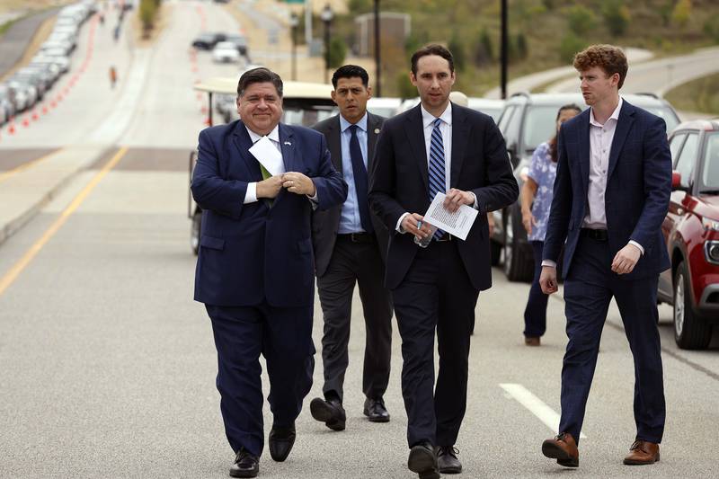 Illinois Gov. JB Pritzker arrives with his staff for the long-awaited opening of Longmeadow Parkway over the Fox River Thursday, Aug. 29, 2024 in Algonquin.