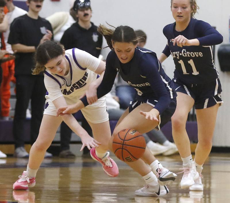 Cary-Grove's Morgan Haslow steals the ball from Hampshire's Ashley Herzing during a Fox Valley Conference girls basketball game Friday, Jan. 26, 2024, at Hampshire High School.