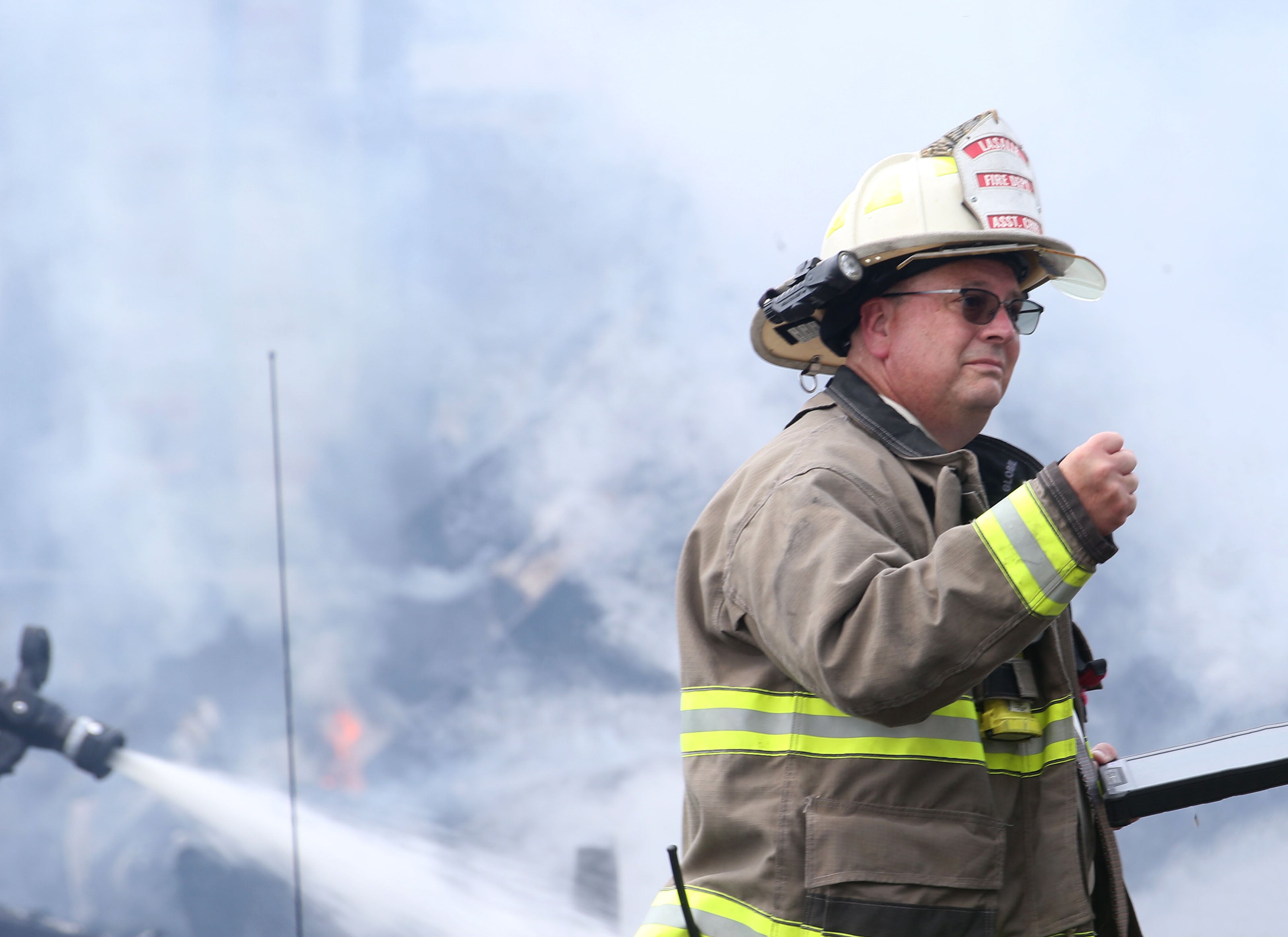 La Salle fire chief Jerry Janick walks near the scene of a garage fire in the 800 block of Lafayette Street on Monday, July 22, 2024. The fire began just before 1p.m. La Salle Fire and EMS along with Peru Fire department responded to the call while La Salle Police directed traffic.