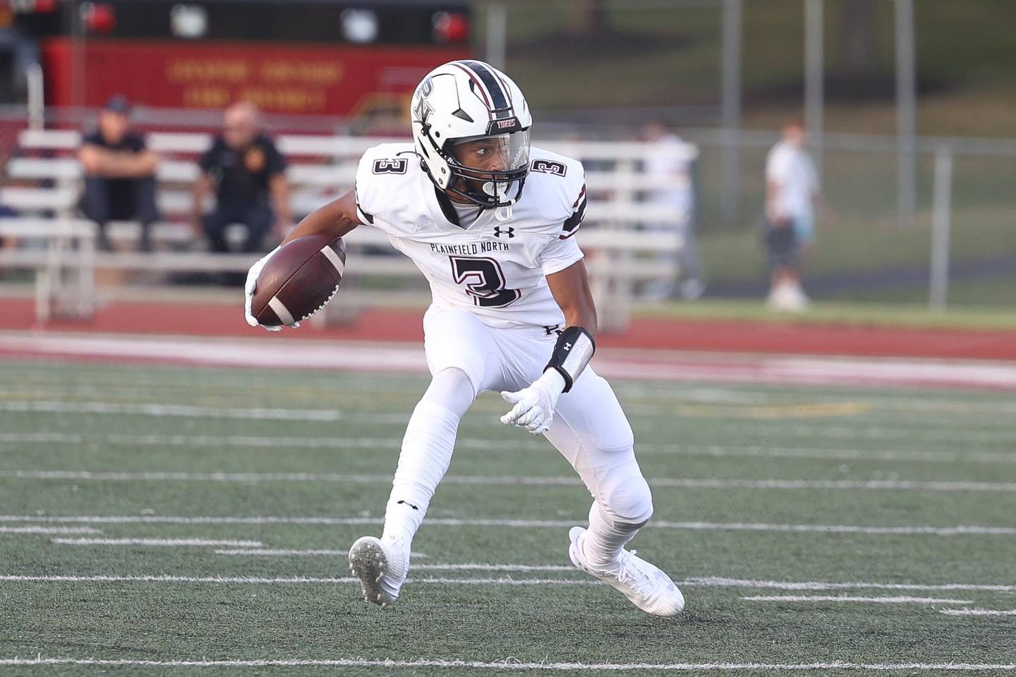 Plainfield North’s Darin Ashiru makes a cut upfield after a catch against Lockport on Friday, August 30, 2024 in Lockport.