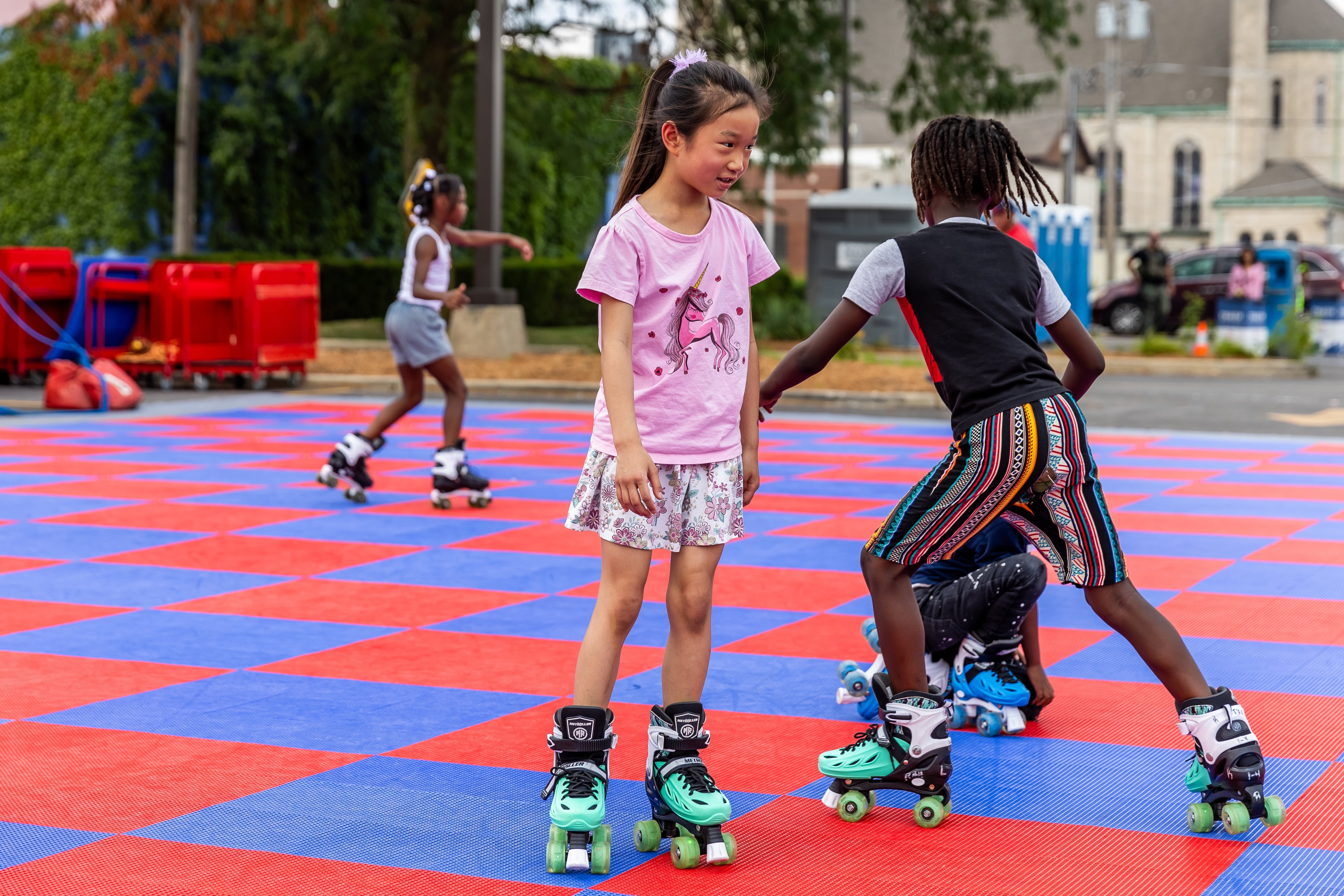 Persephone Tse (8) roller skates at Kidz Fest in Joliet on Aug. 3, 2024.