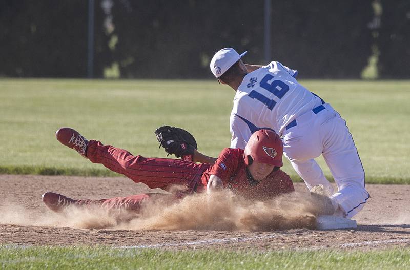 Stillman Valley’s Luke Tompkins is tagged out by Newman’s Isaiah Williams trying to get back to first on a caught line drive against Newman Wednesday, May 22, 2024 in the Class 2A sectional semifinal in Byron.