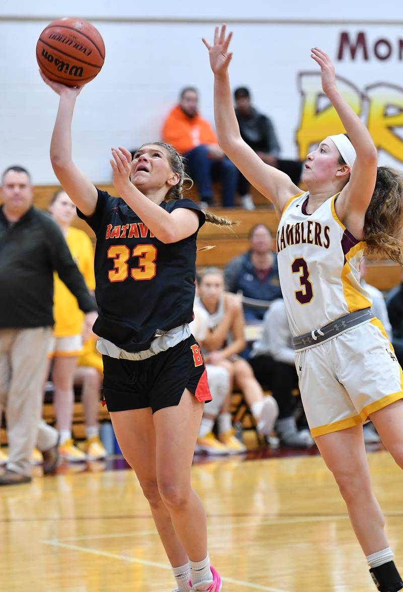 Batavia's Natalie Warner (33) lays the ball up as Loyola's Aubrey Galvan defends during a Coach Kipp Hoopsfest game on Jan. 13, 2024 at Montini Catholic High School in Lombard.