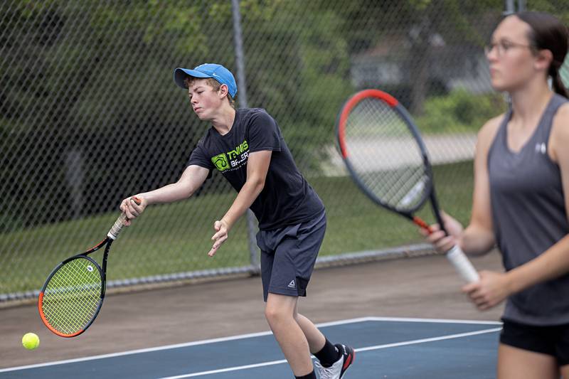 Joel Rhodes returns a shot Wednesday, July 27, 2023 while playing mixed doubles in the Emma Hubbs Tennis Classic in Dixon.