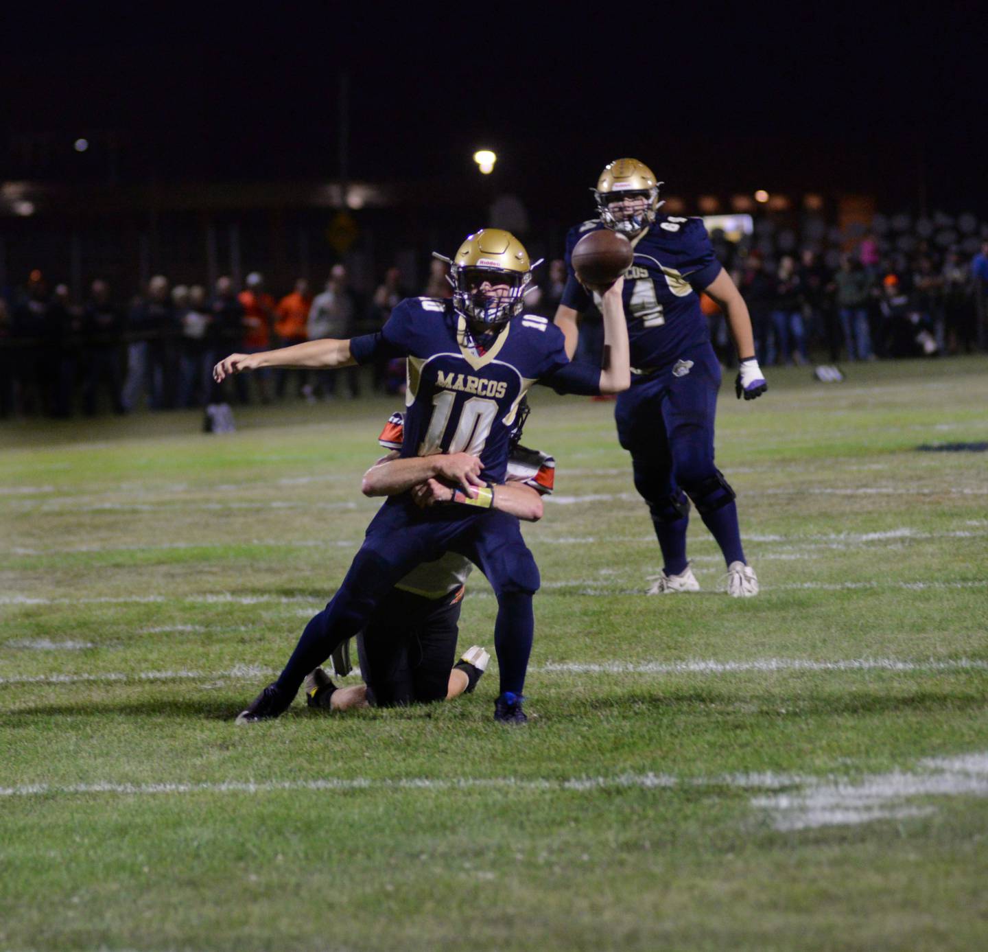 Polo's Carter Merdian (10) tries to pass as he is tackled by a Milledgeville player during Friday, Sept. 8, 2023 action at Polo High School.