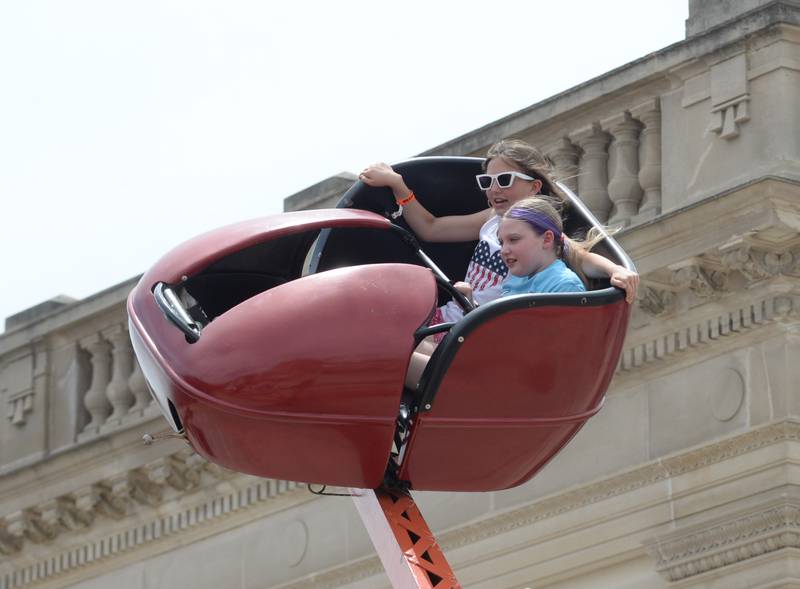 Brooklyn Duffy, 11, and Summer Schubert, 11, of Polo enjoy a carnival ride at Town & Country Days in Polo on Saturday, June 15, 2024.