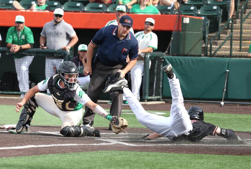 Providence Catholic's Blake Jenner can’t get the tag on in time as Edwardsville's Evan Moore scores their only run during their Class 4A state semifinal game Friday, June 7, 2024, at Duly Health and Care Field in Joliet.