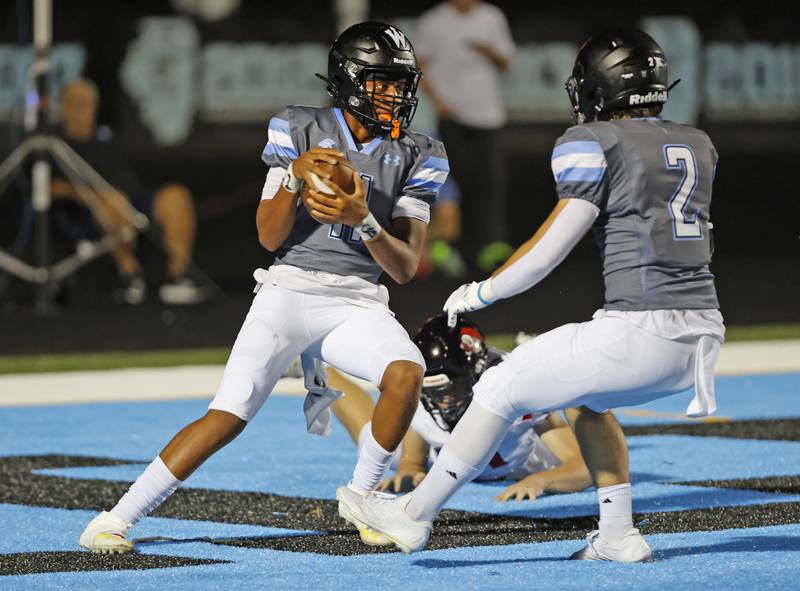 Willowbrook's Jabonise Reed (11) scrambles in the endzone resulting in a safety during the varsity football game between Glenbard East and Willowbrook high schools on Friday, Sep. 30, 2024 in Villa Park.