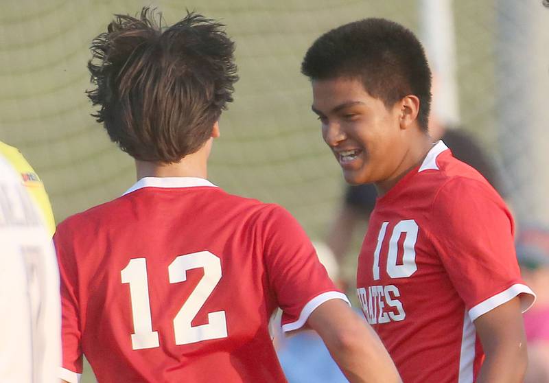 Ottawa's Michael Bedolla reacts with teammate Alexio Fernandez after scoring the teams second goal against Kaneland on Wednesday, Sept. 11, 2024 at King Field.