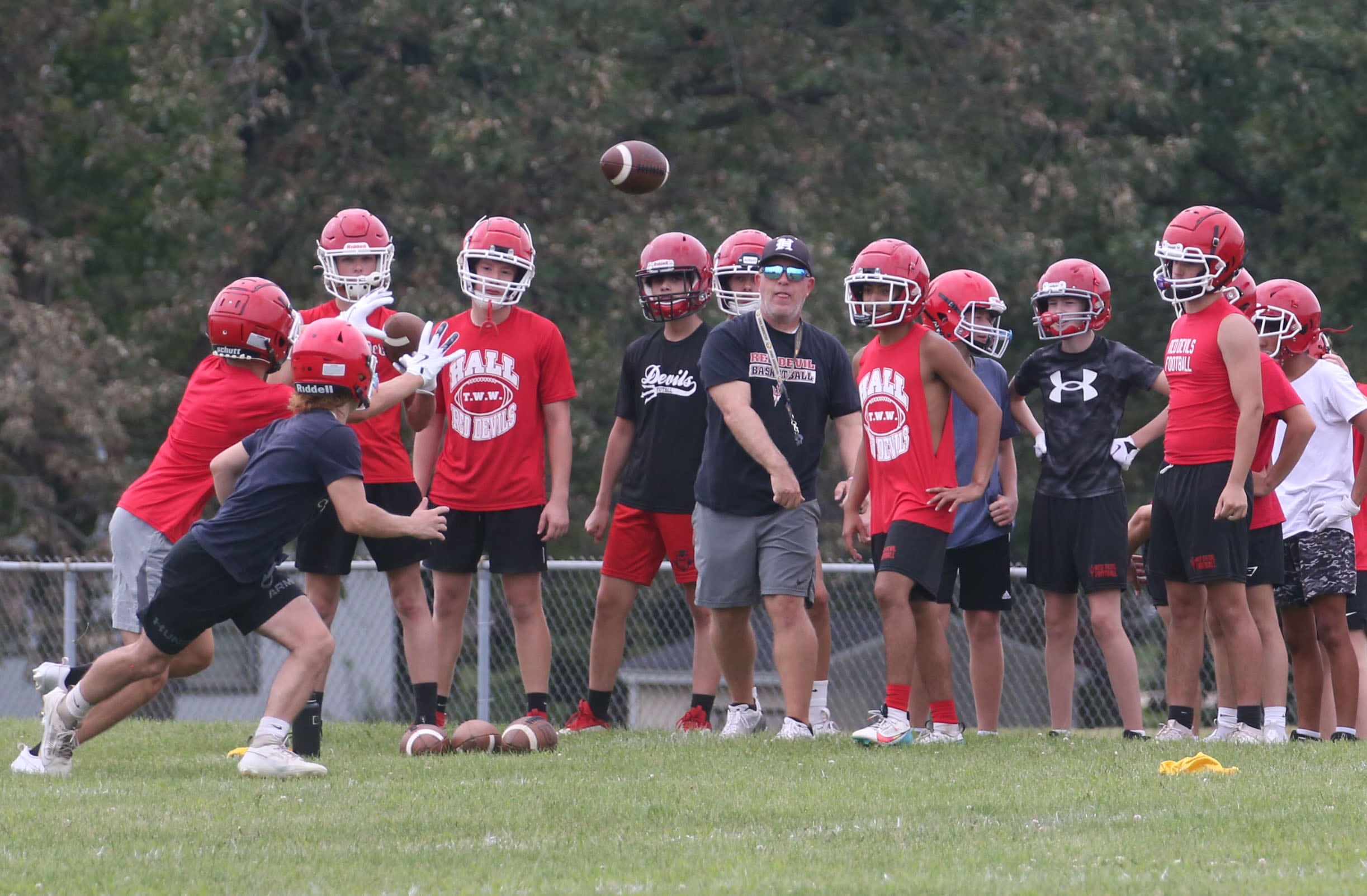 Members of the Hall football team run drills during the first day of practice on Monday, Aug. 12, 2024 at Hall High School.