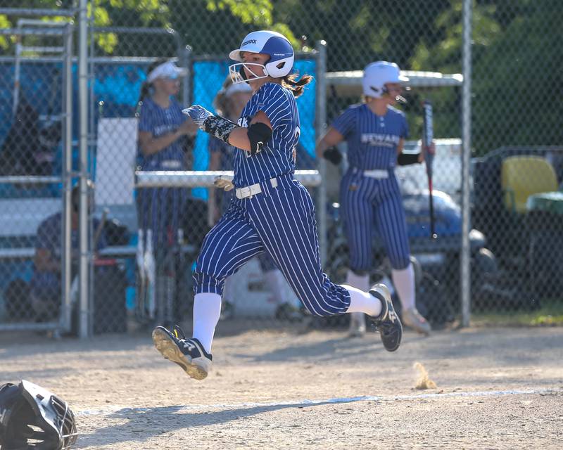 Newark's Adelaide Johnson (22) approaches home plate to score during Class 1A Newark Regional final game between St. Edwards at Newark. May 17th, 2024.