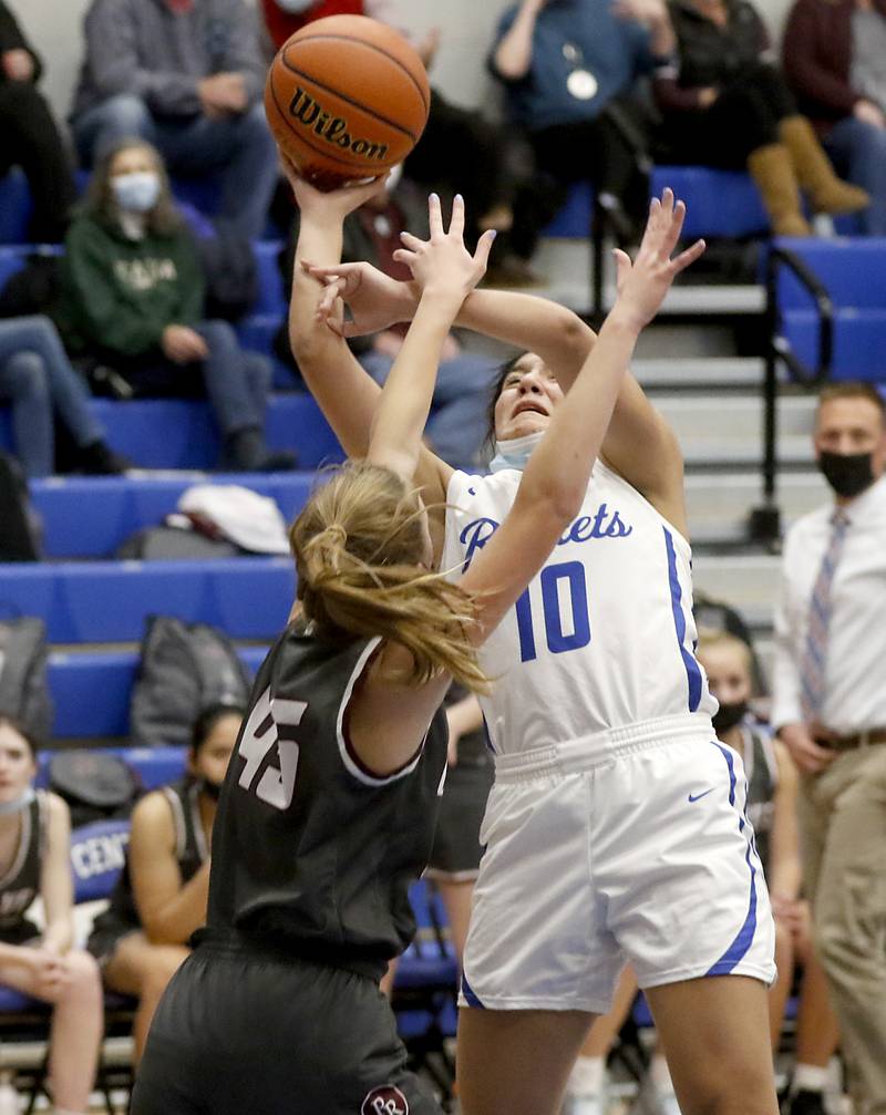 Burlington Central's Samantha Origel, right, tries to shoot over Prairie Ridge's Isabella Pollastrini during Fox Valley Conference girls basketball game Monday evening, Jan. 31 2022, between Prairie Ridge and Burlington Central at Burlington Central High School.