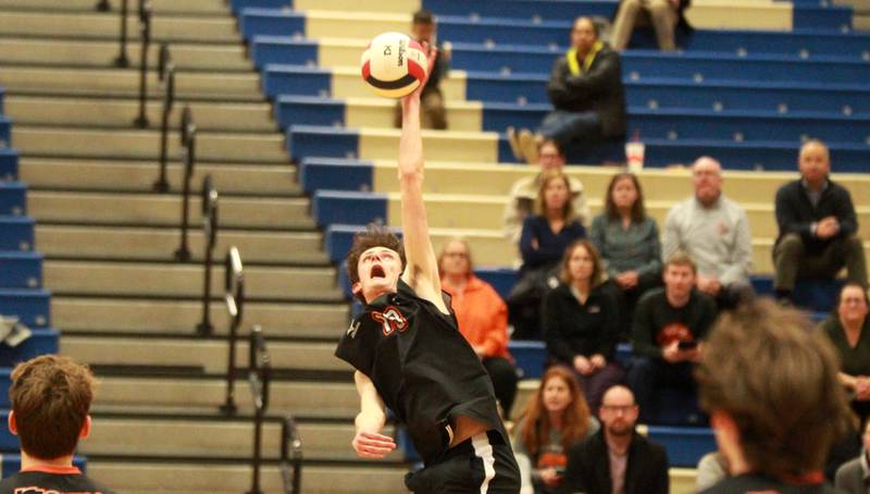 Wheaton Warrenville South’s Quinn Harty goes up for a kill during a game at Geneva on Tuesday, April 2, 2024.