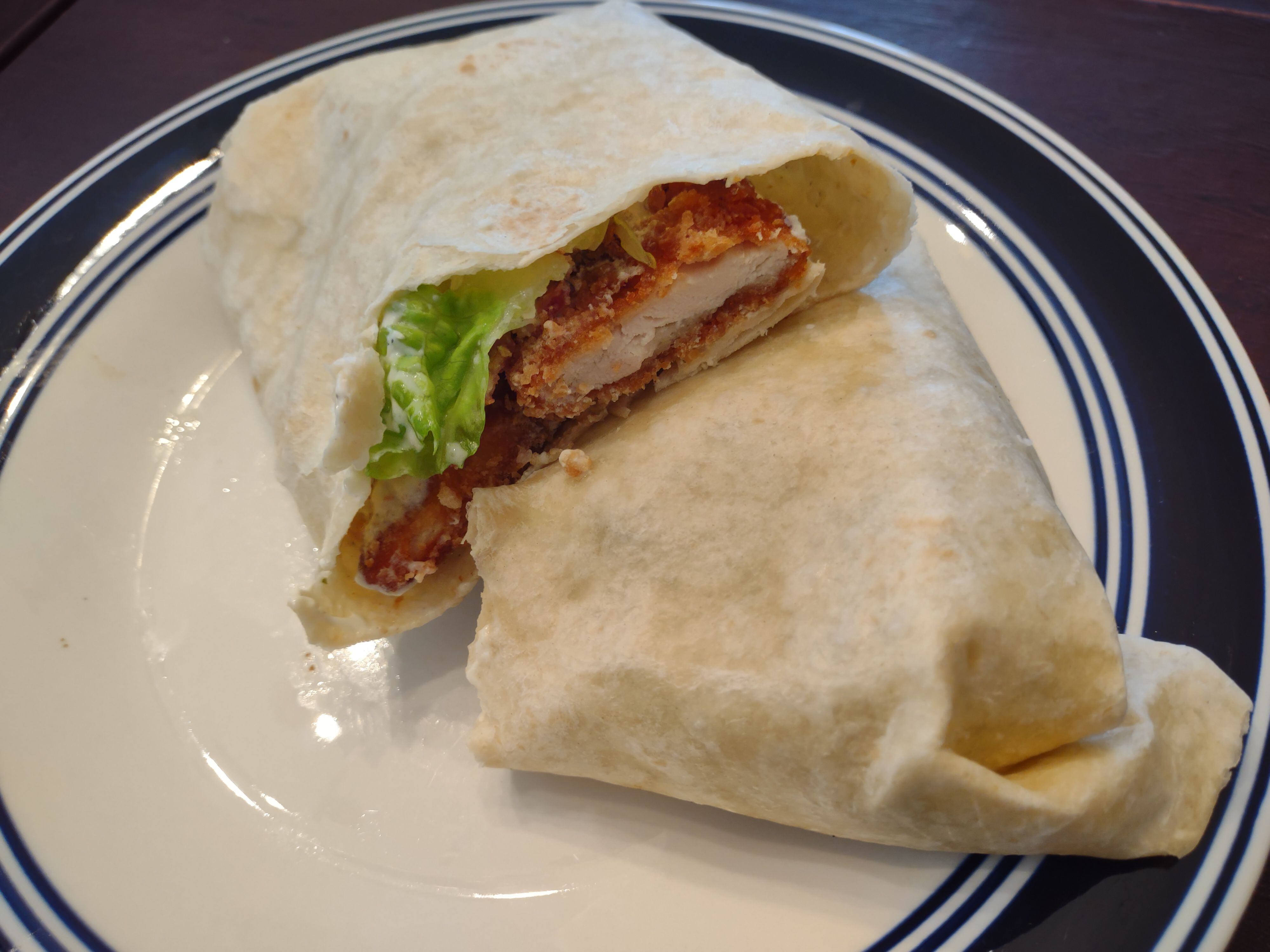 The bacon chicken ranch wrap is served with a full chicken breast at O-9ers' Pub in Streator.