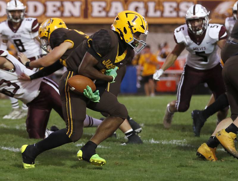 Jacobs' Tyvon Boddie recovers a sloping football as runs with the ball during a Fox Valley Conference football game against Prairie Ridge on Friday, Aug 30, 2024, at Jacobs High School in Algonquin.