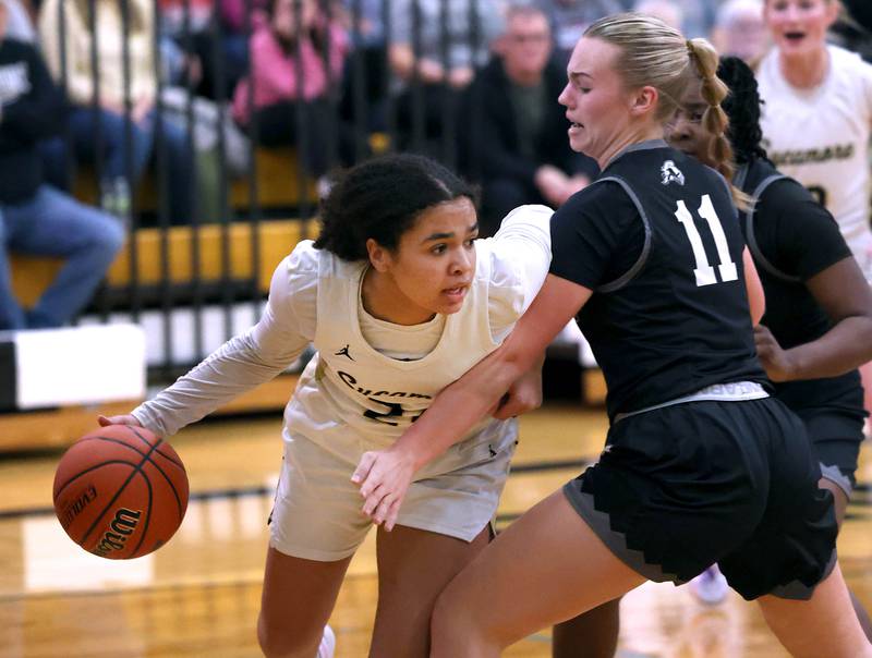 Sycamore's Monroe McGhee tries to get around Kaneland's Berlyn Ruh during their Class 3A sectional semifinal Tuesday, Feb. 20, 2024, at Sycamore High School.