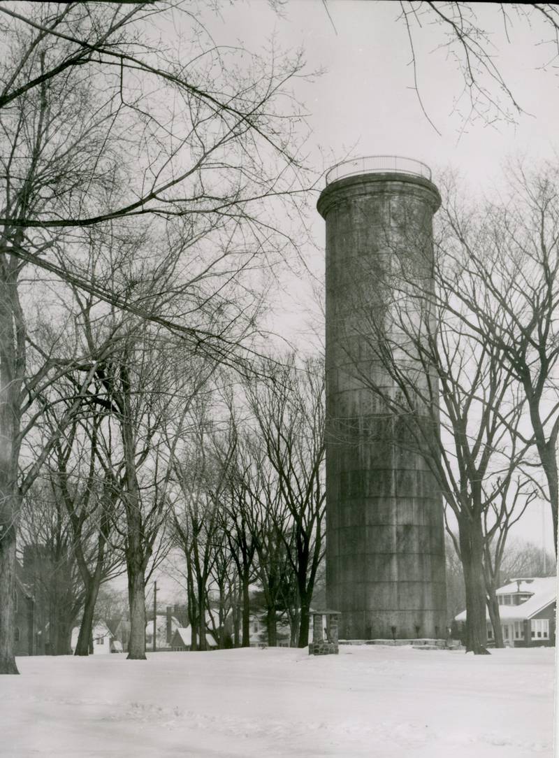 The 85-foot-tall standpipe for the old water works in Huntley Park in DeKalb, looking northeast towards the intersection of South 3rd and Prospect Streets, December 28, 1951.