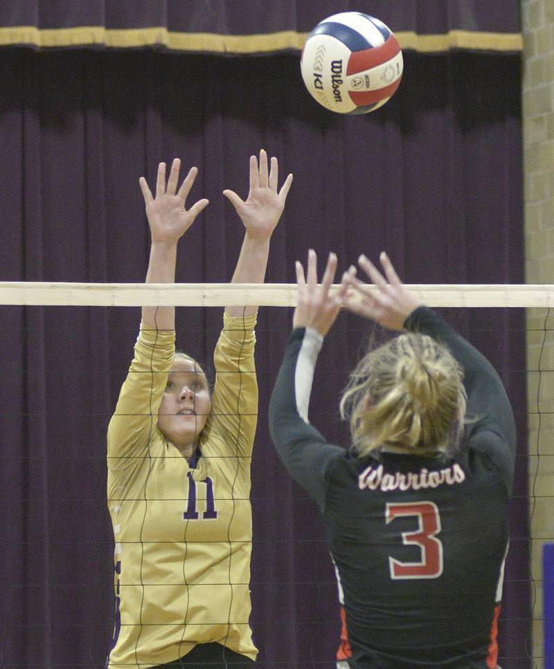 Serena’s Lucy Kelley prepares to block a shot by Woodland’s Sydney Ewing in the first set Tuesday at Serena.