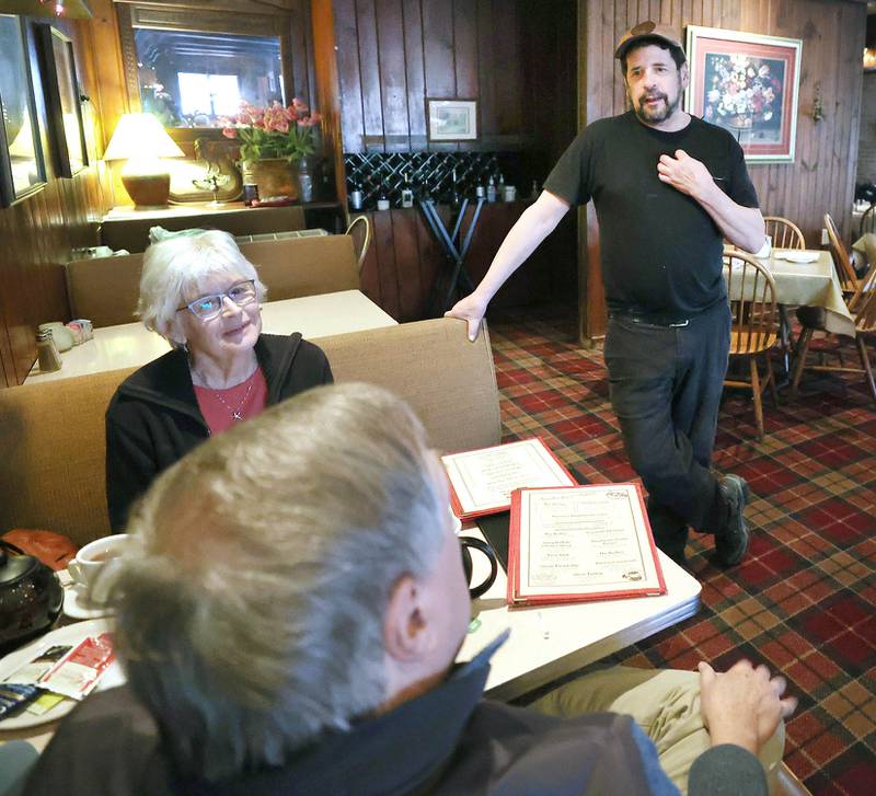 The Hillside Restaurant owner Gavin Wilson (right) talks to regulars Vincent Boone and Vicki Erwin, of DeKalb, Wednesday, Feb. 22, 2023, at eatery in DeKalb. Hillside will soon be closing its doors after 68 years in business.