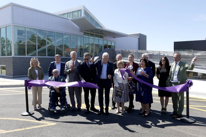 Elected officials and McHenry County College Board Members celebrate the ribbon cutting for the Foglia Center for Advanced Technology and Innovation on Tuesday, Sept. 3, 2024, at McHenry County College.