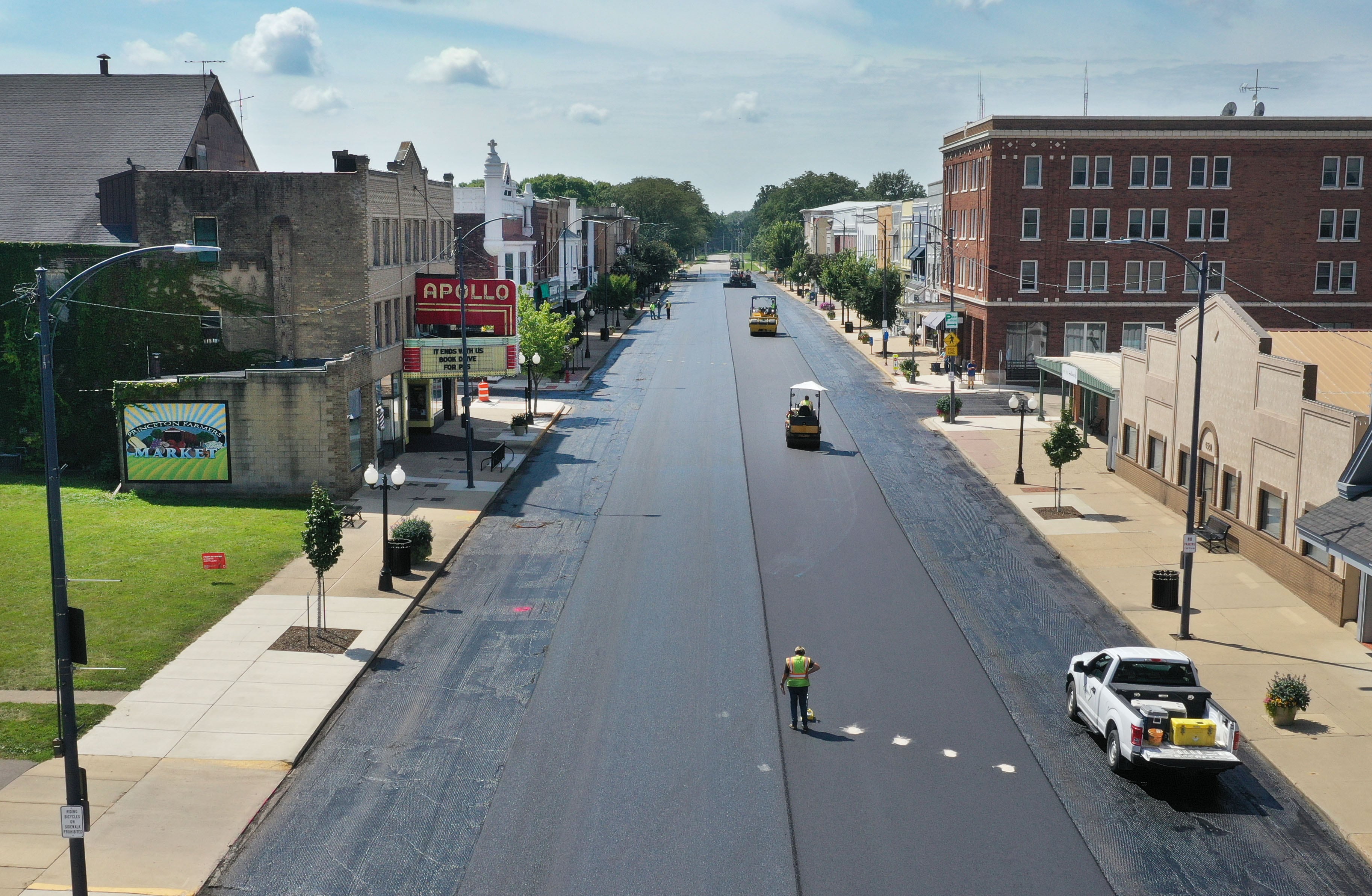 An aerial view of fresh blacktop as crews pave South Main Street in front of the Apollo Theater on Tuesday, Aug. 13, 2024 downtown Princeton.