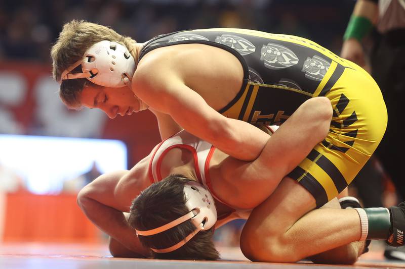 Joliet West’s Carson Weber works over Batavia’s Aidan Huck in the 144-pound Class 3A state 3rd place match on Saturday, Feb. 17th, 2024 in Champaign.