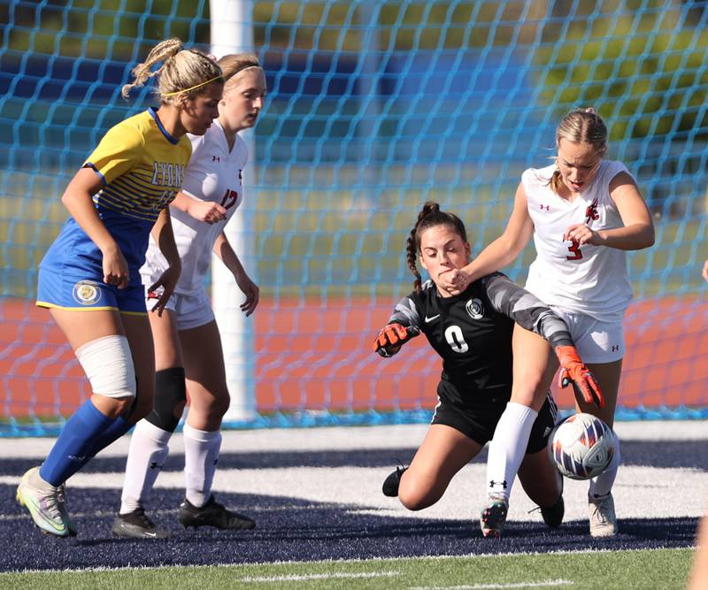 Lyons Township goalkeeper Sara Schinker (0) fights for the ball against Hinsdale Central Cate McDonnell (3) during the IHSA Class 3A girls soccer sectional final match between Lyons Township and Hinsdale Central at Reavis High School in Burbank on Friday, May 26, 2023.